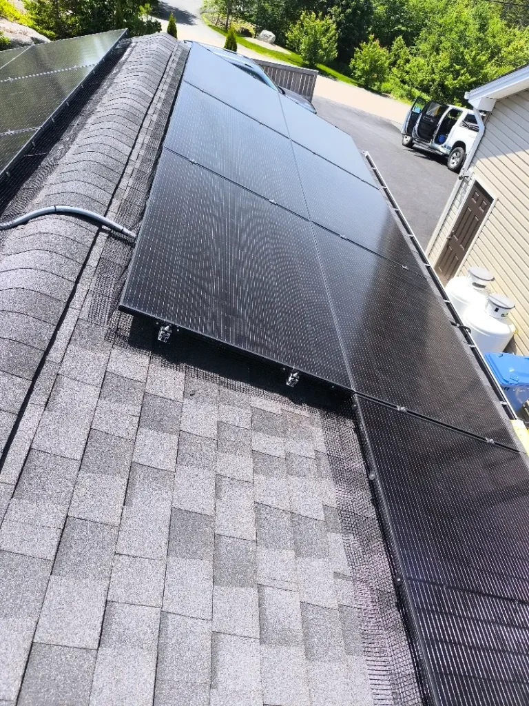 Residential rooftop installation designed for efficient Solar Halifax performance, with solar panels on a dark-shingled roof.