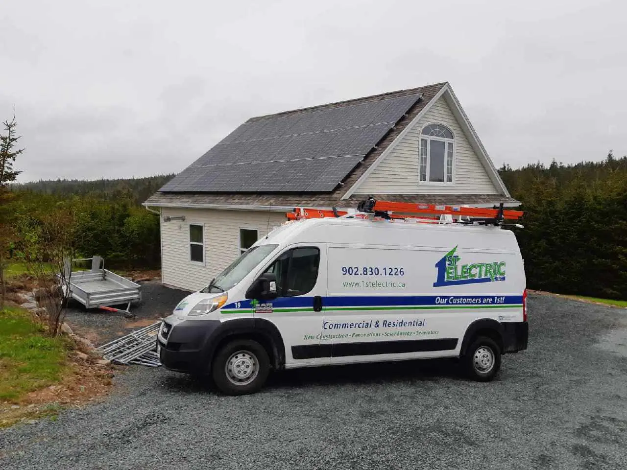 A solar-powered home in Nova Scotia with a service van from 1st Electric parked nearby, highlighting residential use of Solar Energy in Nova Scotia.